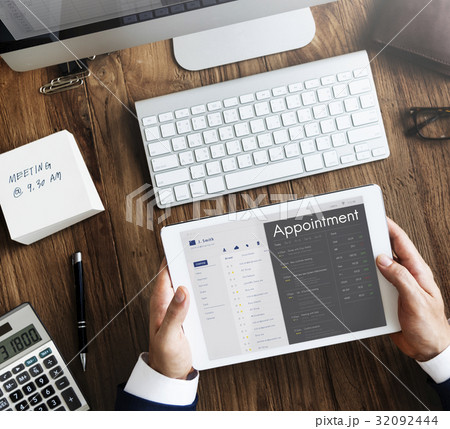 Business people checking appointment on personal organizer schedule 32092444