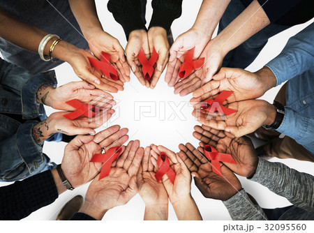 Group of hands holding red ribbon stop drugs and HIV/AIDS awareness Group of hands holding red ribbon stop drugs and HIV/AIDS awareness 32095560