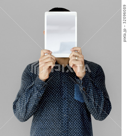 Man holding blank digital tablet cover face studio portrait 32096089