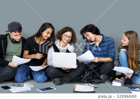 Group of Diverse High School Students Reading Text Book Tutorial 32096600