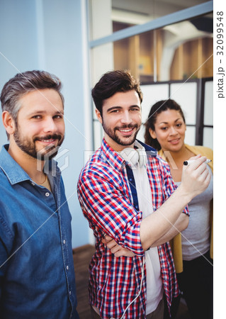 Portrait of confident business partners at creative office 32099548