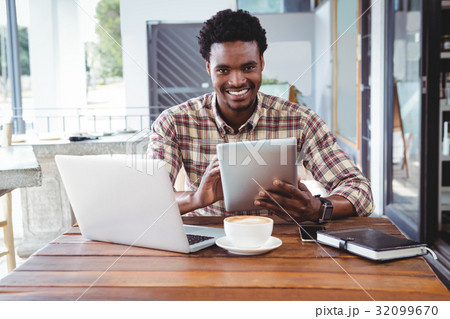 Man using digital tablet 32099670