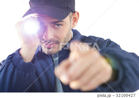 Security officer holding a torch 32100427