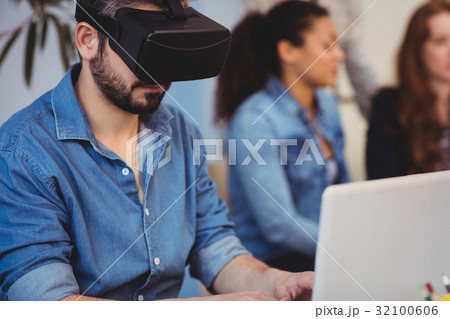 Businessman wearing virtual reality headset Businessman wearing virtual reality headset 32100606