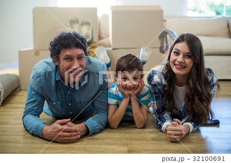 Family lying on the floor Family lying on the floor 32100691