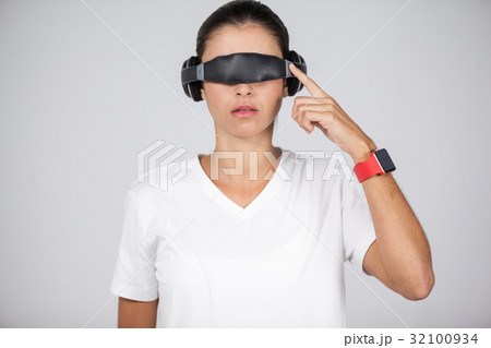 Woman using virtual video glasses 32100934
