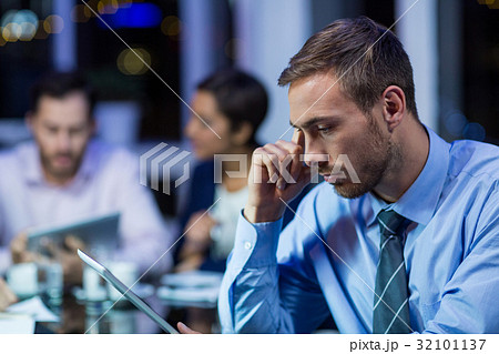 Businessman using digital tablet Businessman using digital tablet 32101137