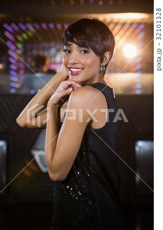 Young woman dancing on dance floor 32101328