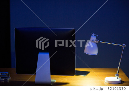 Close-up computer monitor and illuminated lamp 32101330