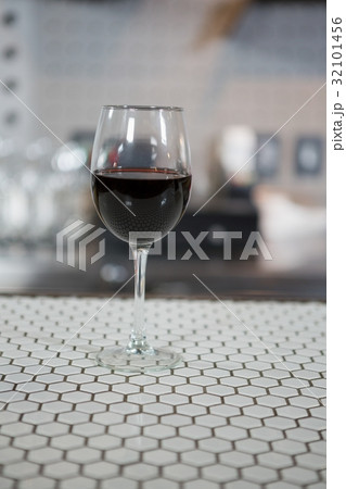Glass of red wine on counter 32101456