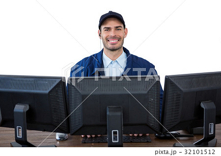 Portrait of happy security officer using computer 32101512