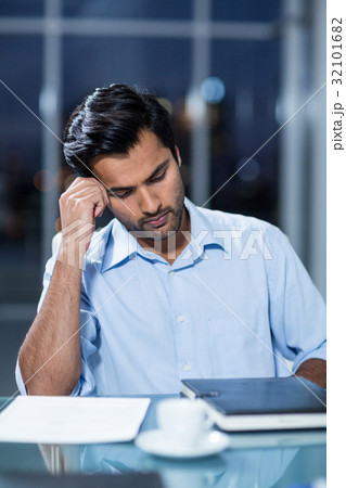 Sad man sitting at his desk Sad man sitting at his desk 32101682