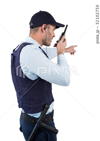 Security officer talking on walkie-talkie 32102750