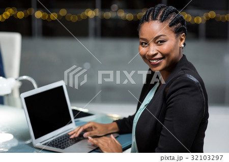 Businesswoman using laptop 32103297