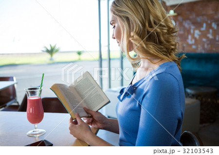 Woman reading a novel Woman reading a novel 32103543