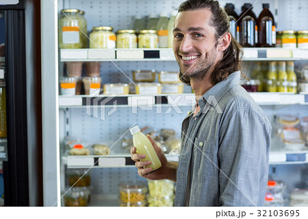 Portrait of happy man shopping for groceries Portrait of happy man shopping for groceries 32103695