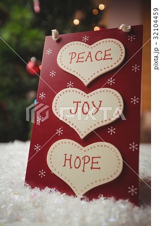 Christmas label with massages of peace, joy and hope Christmas label with massages of peace, joy and hope 32104459
