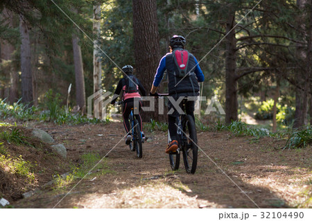 Biker couple cycling in countryside 32104490
