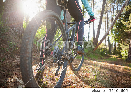 Low section of female mountain biker riding bicycle 32104606