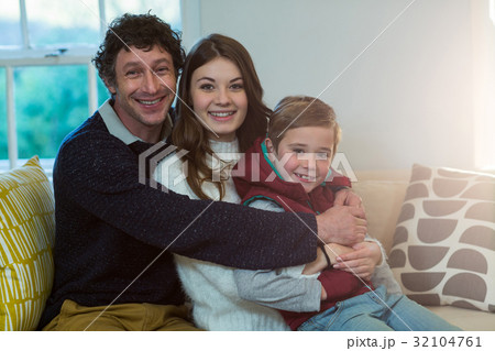 Happy family sitting on a sofa Happy family sitting on a sofa 32104761