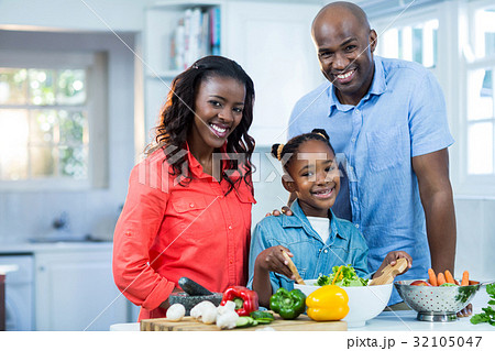 Happy family preparing food Happy family preparing food 32105047