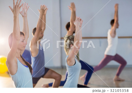 Group of fitness team performing stretching exercise Group of fitness team performing stretching exercise 32105358