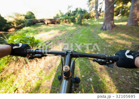 Close-up of male mountain biker riding bicycle 32105695