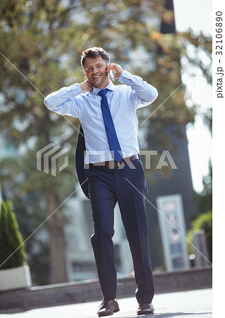 Portrait of handsome businessman talking on mobile phone Portrait of handsome businessman talking on mobile phone 32106890