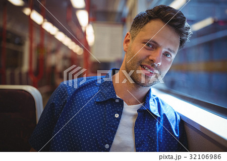 Handsome man looking through window 32106986