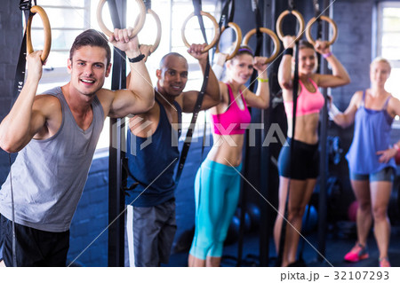 Portrait of smiling people with gymnastic rings Portrait of smiling people with gymnastic rings 32107293