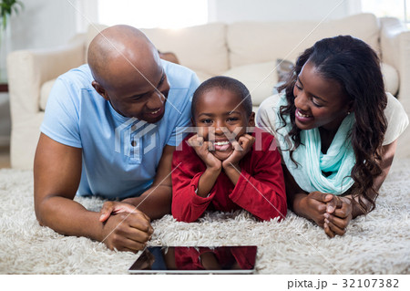Family with digital tablet Family with digital tablet 32107382