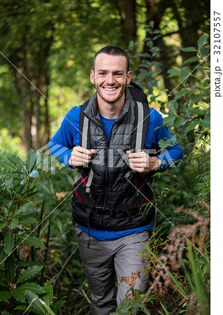 Male hiker in forest Male hiker in forest 32107557