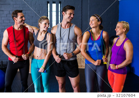 Male and female athletes with jump rope 32107604