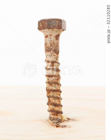 Rusted old screw isolated 32110285