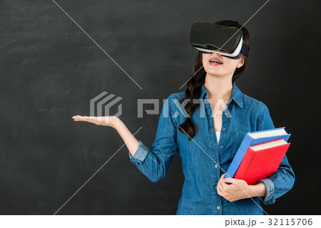 woman student presenting with VR headset device woman student presenting with VR headset device 32115706