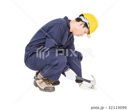 Handyman in uniform with his hammer Handyman in uniform with his hammer 32119096