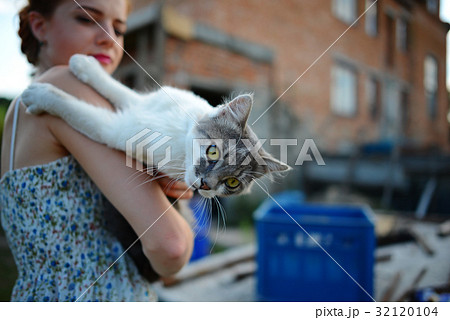 woman holding Scottish straight shorthair cat woman holding Scottish straight shorthair cat 32120104