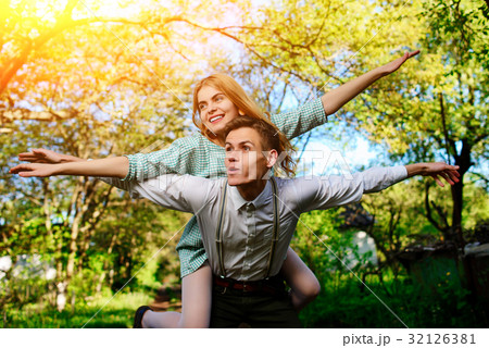 couple raising their hands in open air 32126381