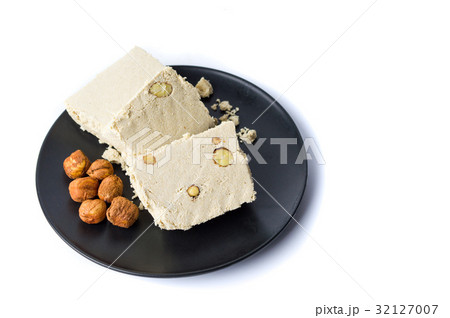 Hazelnut halva slices on a plate Hazelnut halva slices on a plate 32127007
