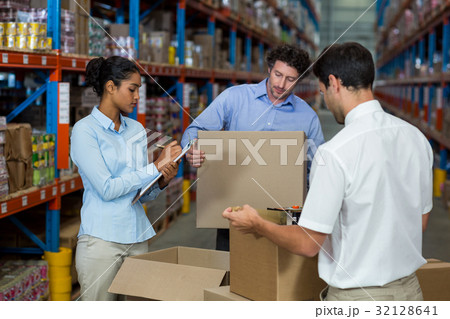 Warehouse workers preparing a shipment 32128641
