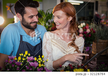 Couple using digital tablet 32128764