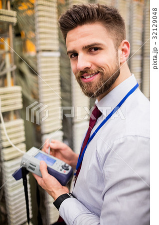 Technician using digital cable analyzer Technician using digital cable analyzer 32129048