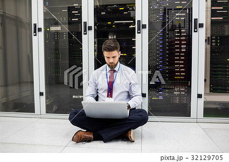 Technician using laptop Technician using laptop 32129705