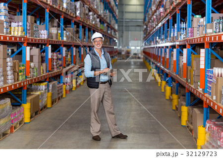 Portrait of warehouse worker using digital tablet 32129723