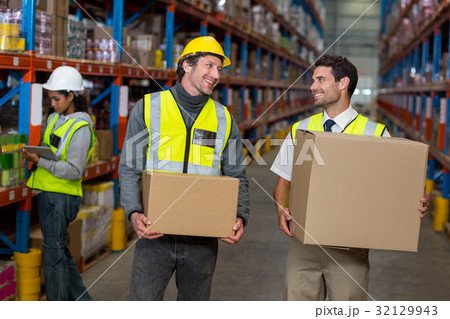 Warehouse worker interacting with each other Warehouse worker interacting with each other 32129943