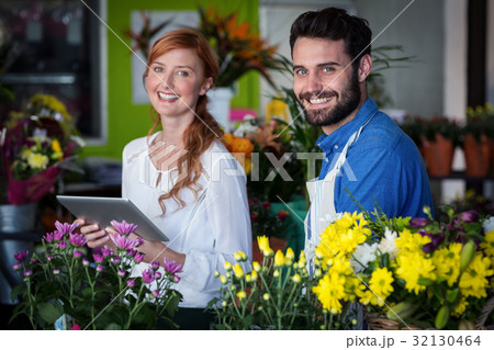 Couple standing with digital tablet 32130464