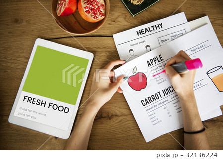 Hands working on digital device network graphic overlay 32136224