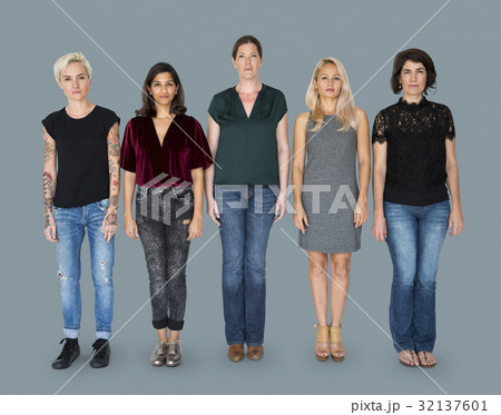 Group of women standing in a row together 32137601