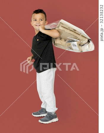 Little Boy Holding Separate Papers Studio Portrait Little Boy Holding Separate Papers Studio Portrait 32138232