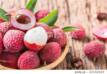 fresh organic lychee fruit on bamboo basket 32142024